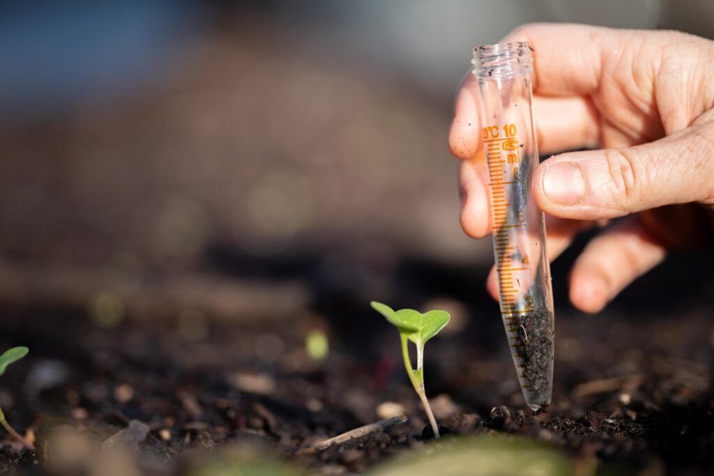 farmer collecting soil samples test tube field agronomist checking soil carbon plant health farm soil science agriculture